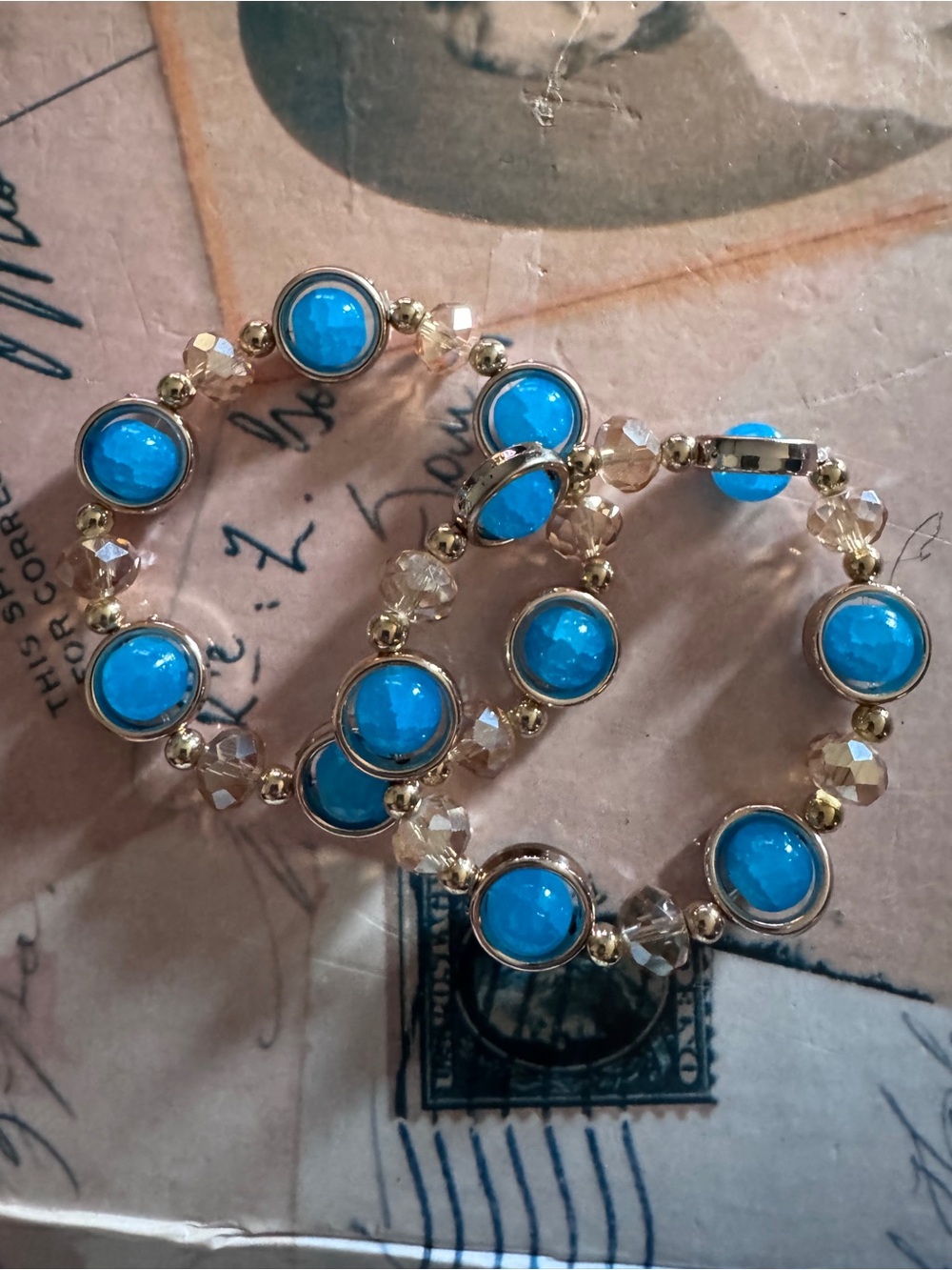 Gold-Tone Bracelet with Blue Resin Center and Clear Beads